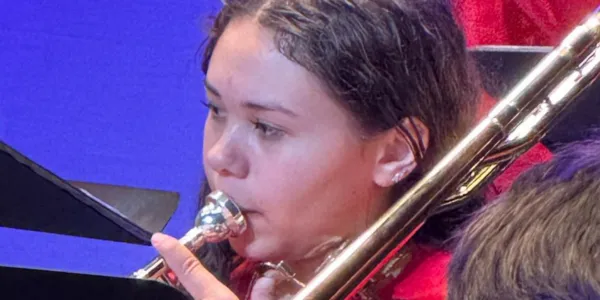 Student trombonist performing at the festival